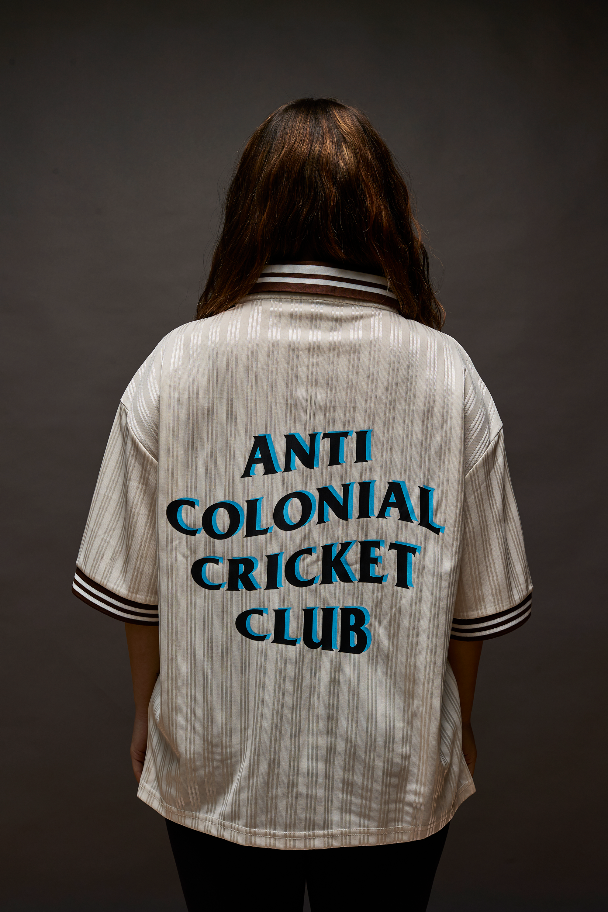 Windies Cricket Jersey back view showing Anti Colonial Cricket Club logo.
